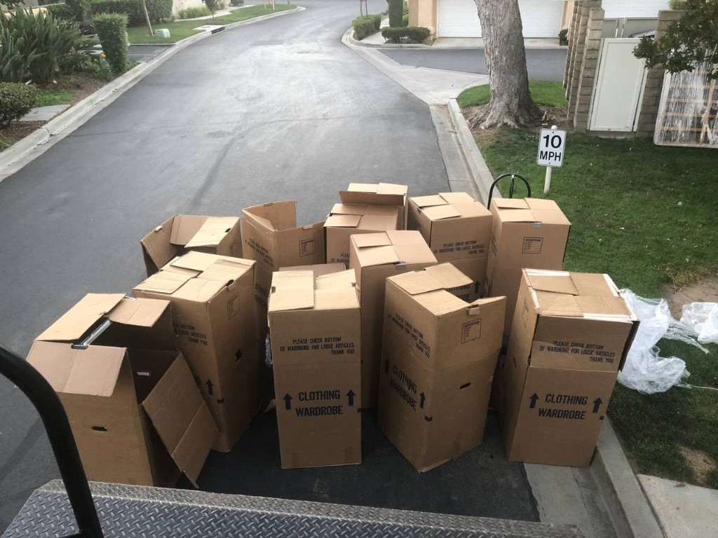 Clothing wardrobe boxes lined up for a residential move