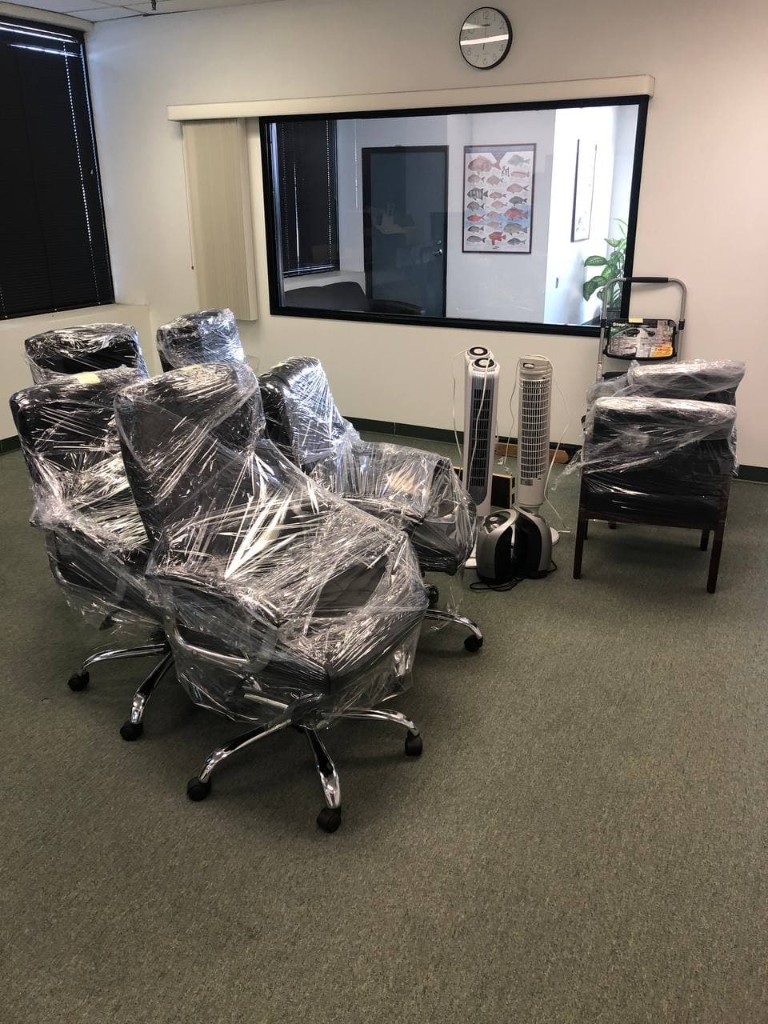 Office chairs and equipment wrapped for commercial relocation